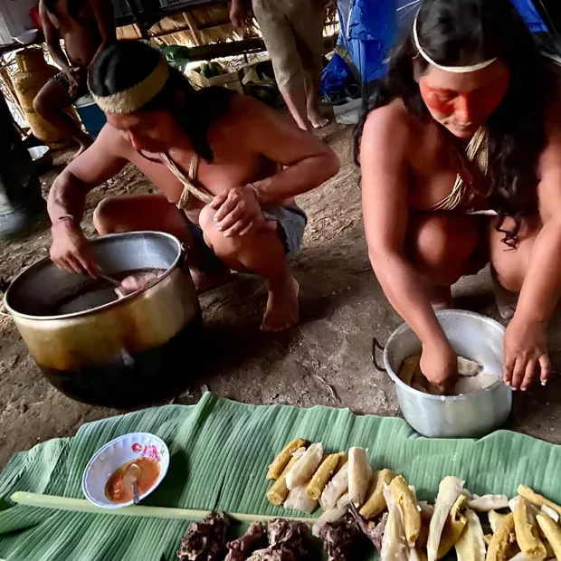 Women preparing cassava and plantain the traditional way