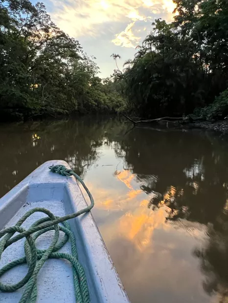 Bow of a boat on the river at golden hour