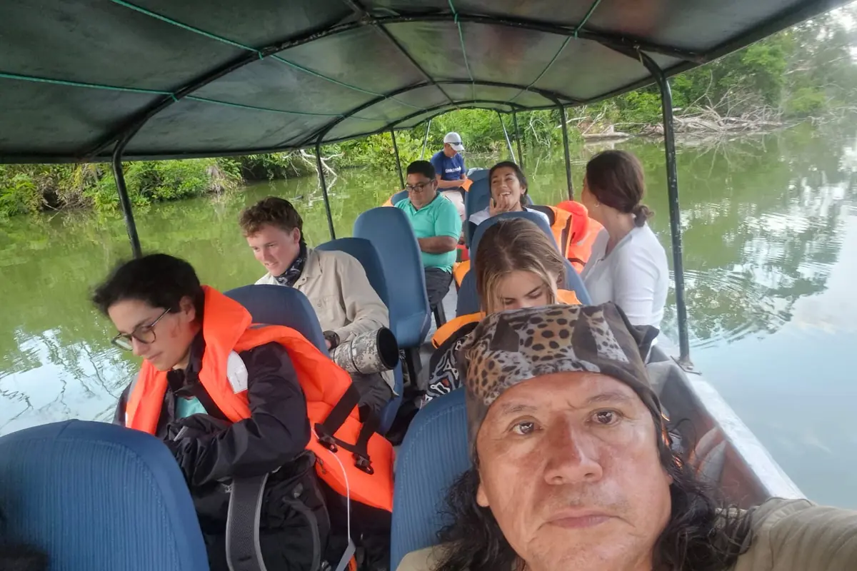 Passengers traveling along the Napo River toward Yasuní National Park